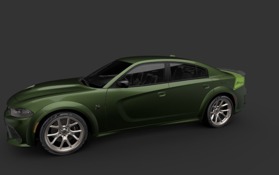 A dark green 2023 Dodge Charger Last Call Special Edition car against a black background. 