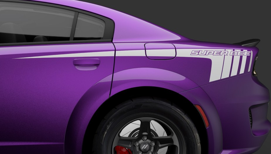 The Dodge Charger Super Bee's rear quarter panel shows off its muscle sedan graphics.