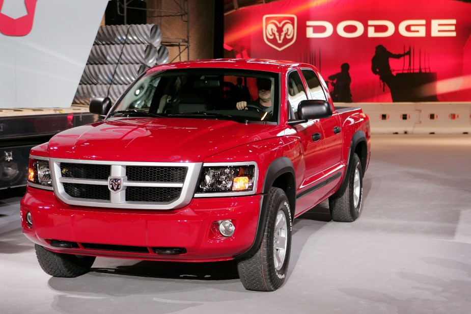 A red Dodge Dakota shows off its styling as a mid-size truck.