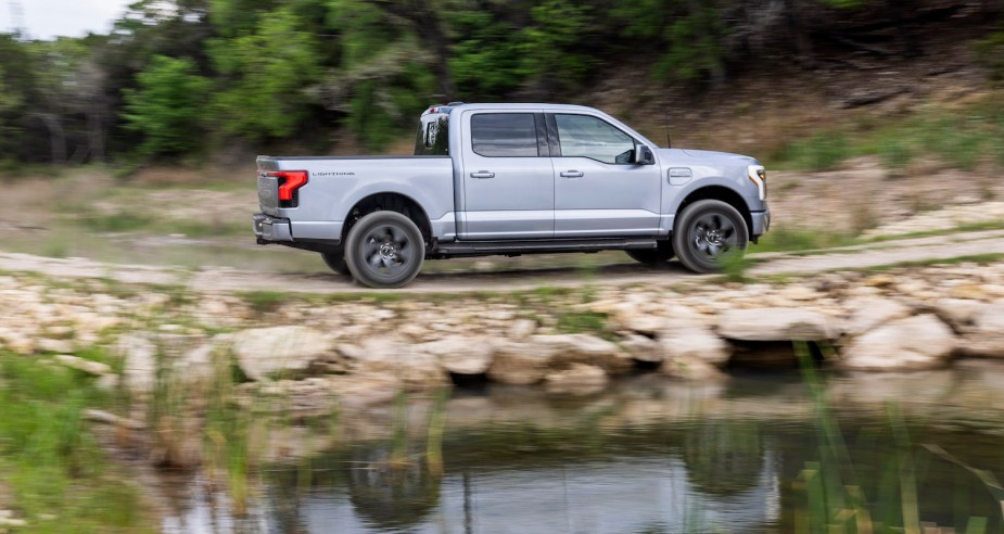 A grey Ford F-150 Lightning going off-road