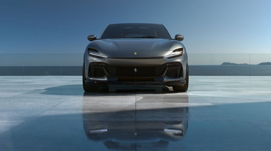 The Ferrari Purosangue luxury high-performance SUV model parked on a marble reflective plaza