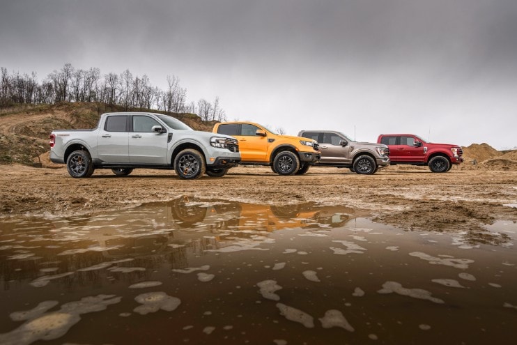 A group of Ford trucks, including the compact pickup the 2023 Ford Maverick Tremor.