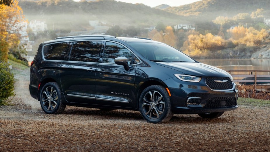 Front angle view of Brilliant Black 2023 Chrysler Pacifica. Why is the Touring L the best version of the minivan?