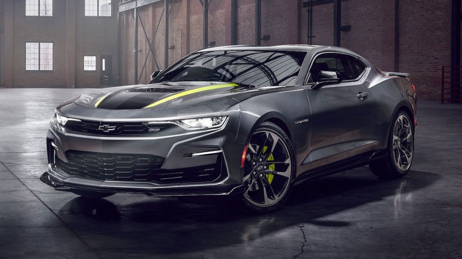Front angle view of gray 2022 Chevy Camaro, affordable sports car alternative to Ford Mustang costing under $30,000