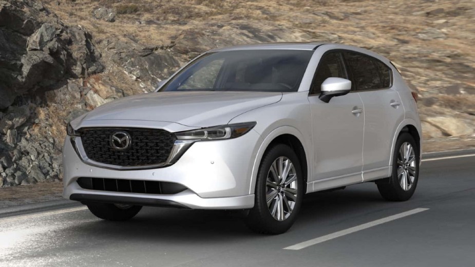 Front angle view of new 2023 Mazda CX-5 crossover SUV with Rhodium White Metallic exterior paint color option
