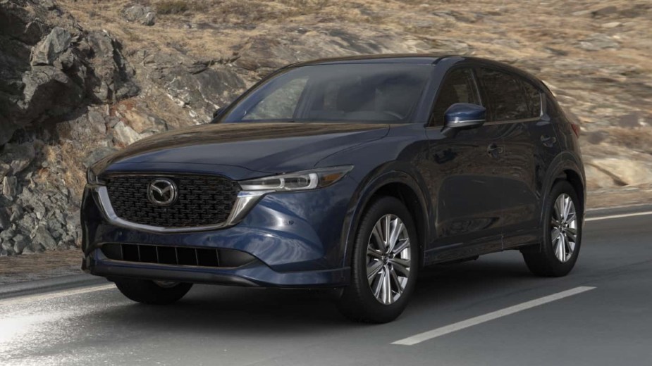 Front angle view of new 2023 Mazda CX-5 with Deep Crystal Blue Mica hue