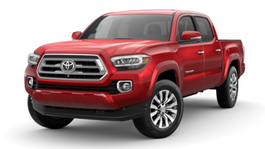 Front angle view of new 2023 Toyota Tacoma midsize pickup truck with Barcelona Red Metallic exterior paint color