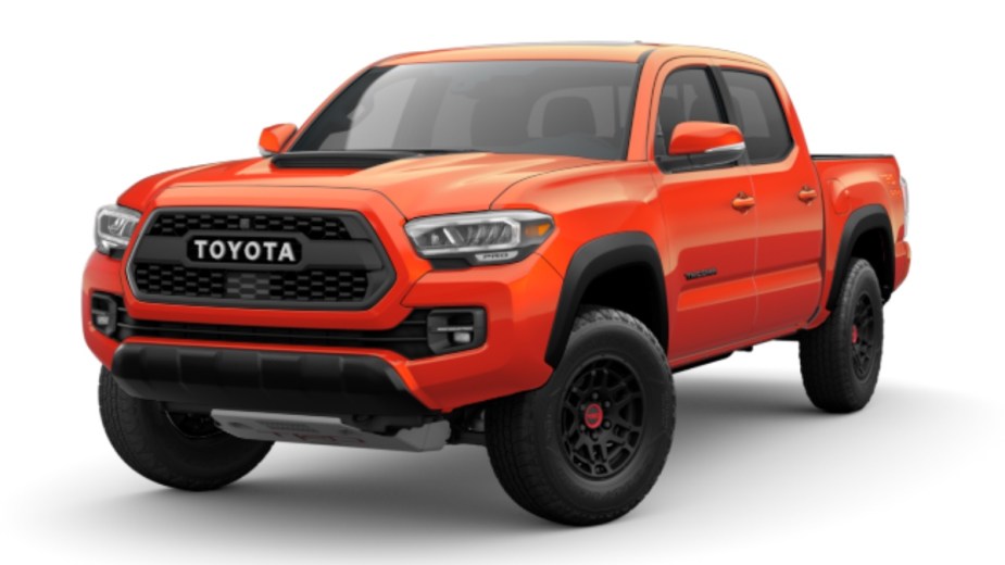 Front angle view of new 2023 Toyota Tacoma midsize pickup truck with Solar Octane exterior paint color