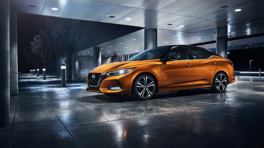 Front angle view of orange 2022 Nissan Sentra, a more affordable alternative to Toyota Corolla costing under $20,000
