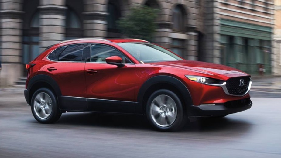 Front angle view of the red 2022 Mazda CX-30, one of the cheapest all-wheel-drive SUVs that costs less than $25,000
