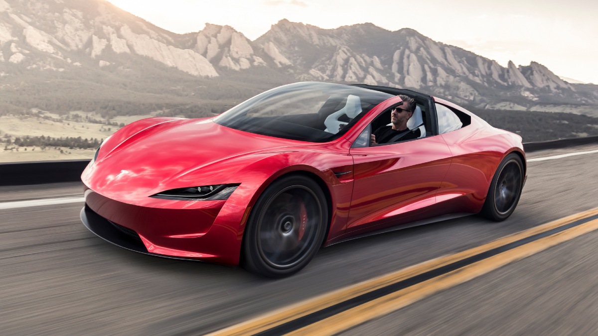 Front angle view of red Tesla Roadster, an upcoming electric convertible car