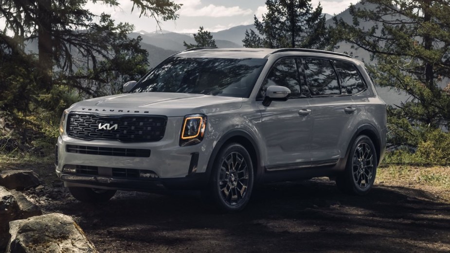 Front angle view of silver 2022 Kia Telluride, affordable midsize SUV alternative to Toyota Highlander costing under $36,000