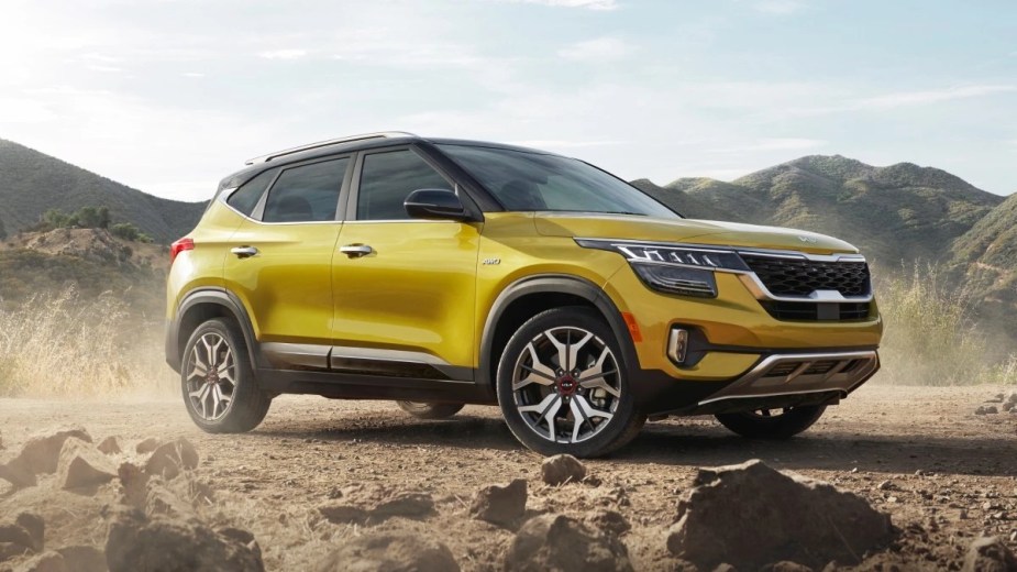 Front angle view of yellow 2023 Kia Seltos, affordable crossover SUV alternative to Honda HR-V that costs under $25,000