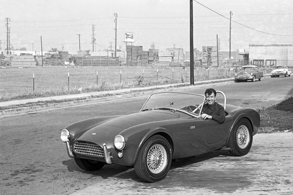 Carroll Shelby, former Le Mans winner, drives a classic Cobra, one of the vehicles he innovated.
