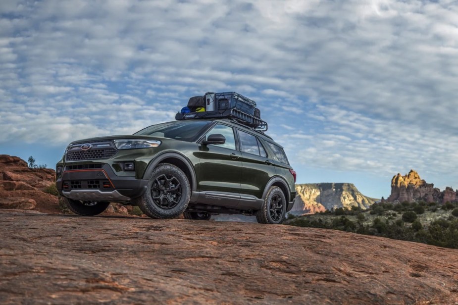Green 2023 Ford Explorer Timberline midsize SUV parked on a hill