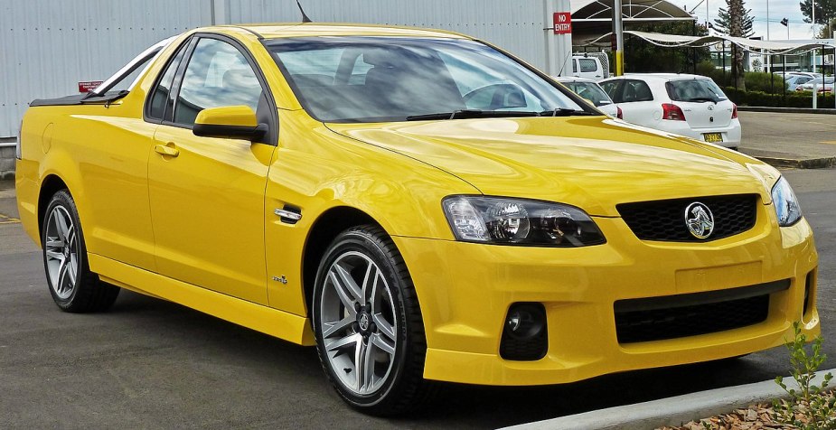 A yellow Holden ute shows off its unique styling with a yellow paint job. 