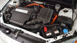 Looking at the engine and powertrain setup under the hood of a 2003 Honda Civic Hybrid