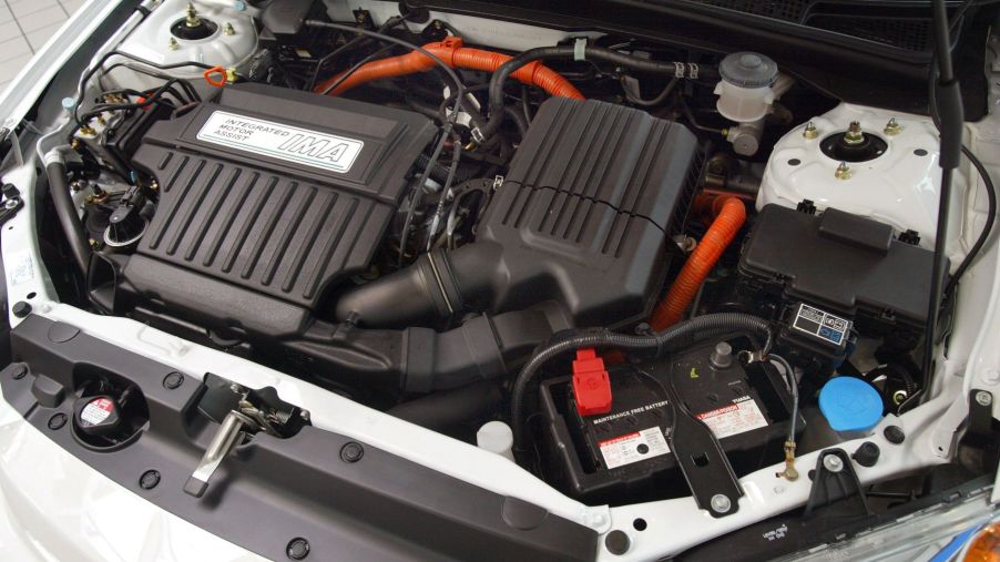 Looking at the engine and powertrain setup under the hood of a 2003 Honda Civic Hybrid