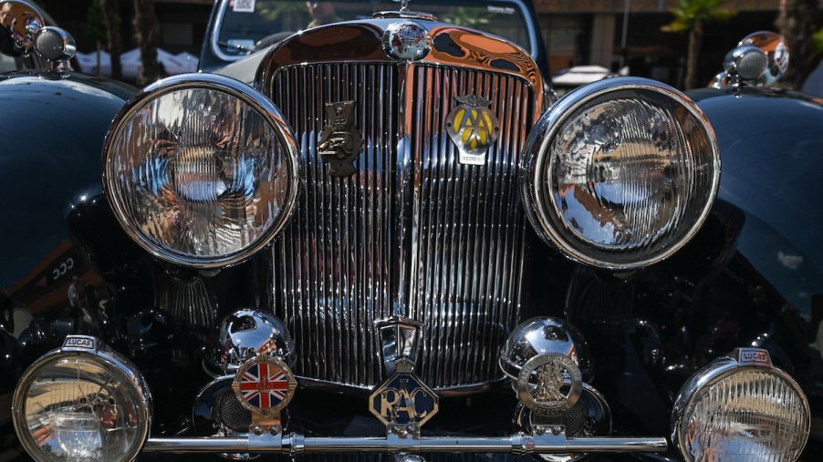 A car with a hood ornament, one of the car features from the past