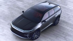 A black Jeep Wagoneer S fully-electric full-size SUV is parked.