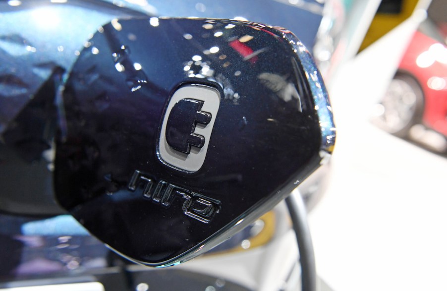 A blue Kia Niro charging door.