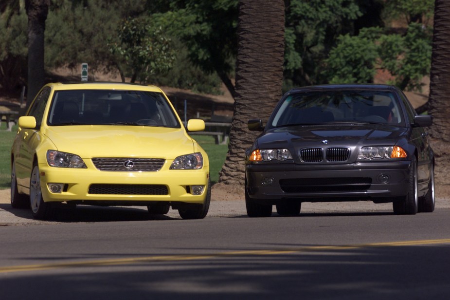 A yellow Lexus IS 300 on the left.