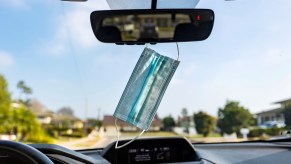 A face mask hanging from your rearview mirror.