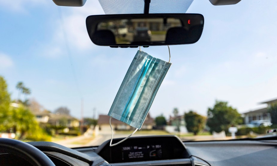 A face mask hanging from your rearview mirror.