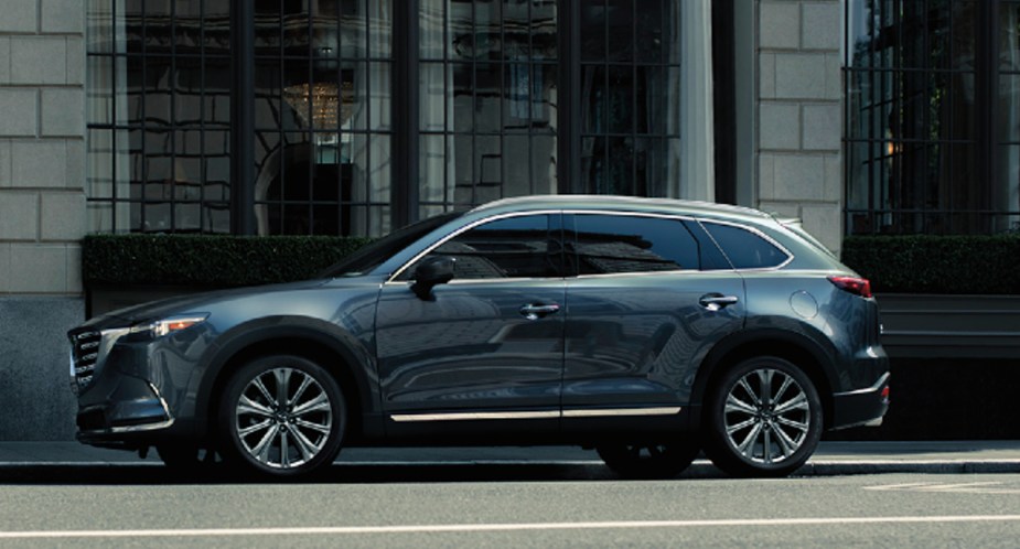 A gray 2023 Mazda CX-9 is parked on the road. 
