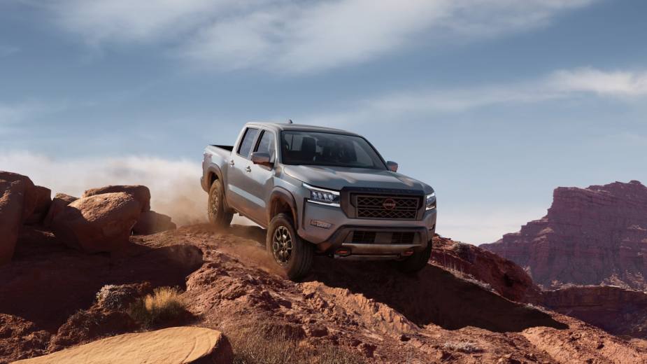 A 2022 Nissan Frontier navigates rough terrain as a mid-size truck.
