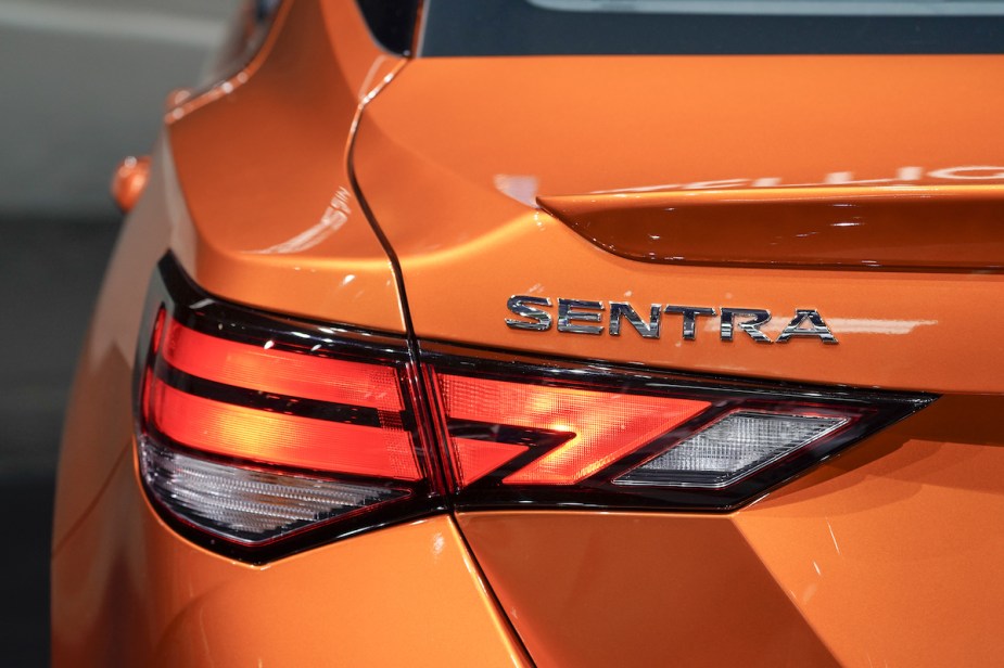 The back end of a 2022 Nissan Sentra in orange. 