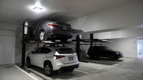 A parking lift inside of a garage.