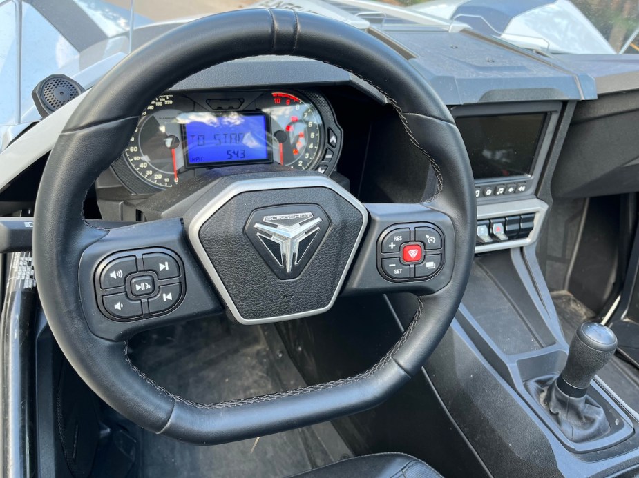 The steering wheel and shifter on the Polaris Slingshot SL.