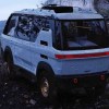 White Potential Motors Adventure 1 Electric Off-Road Camper Van at a remote scenic overlook