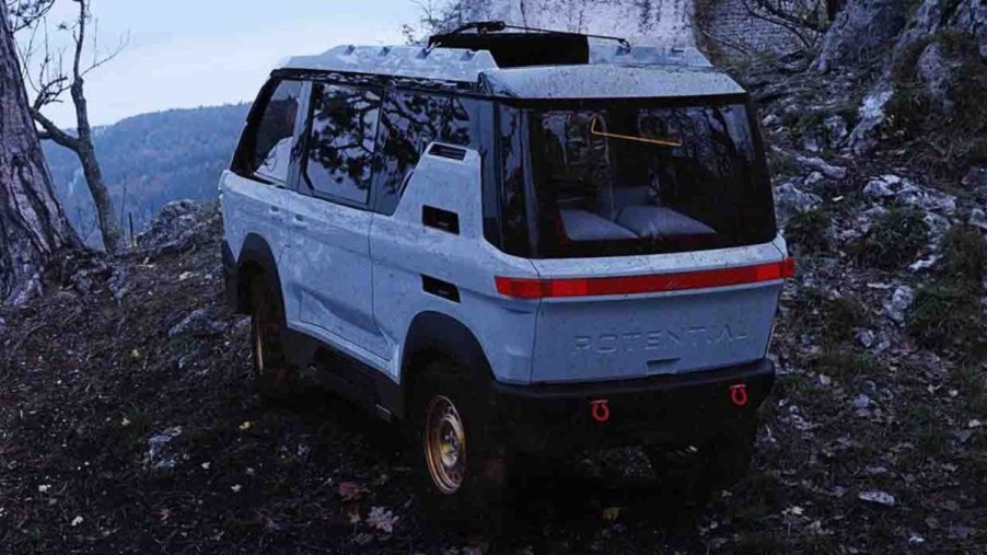 White Potential Motors Adventure 1 Electric Off-Road Camper Van at a remote scenic overlook