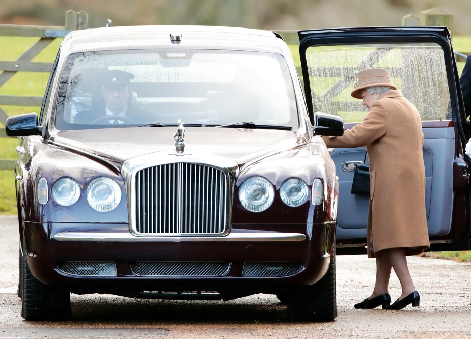 Queen Elizabeth II embarks the Bentley Limousine, one of the cars she loved in addition to many Land Rovers.