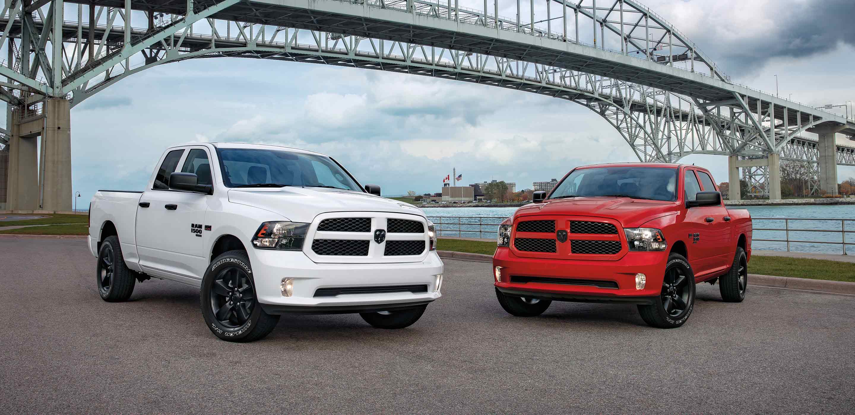 Two Ram Classics parked by a bridge
