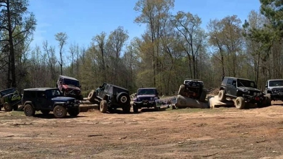 Several Jeeps Getting Muddy
