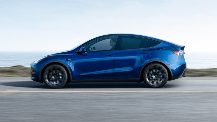 Side view of blue 2022 Tesla Model Y, a more affordable luxury SUV alternative to Tesla Model X