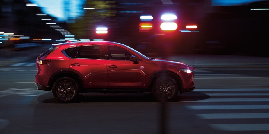 Side view of red 2023 Mazda CX-5 crossover SUV, highlighting how much a fully loaded one costs