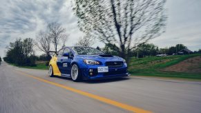 A blue Subaru preparing to street race