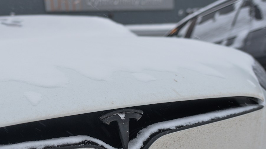 A Tesla EV outside during the winter.