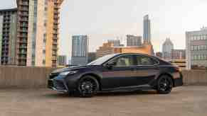 A Black Toyota Camry XSE AWD Midsize Sedan parked in the city
