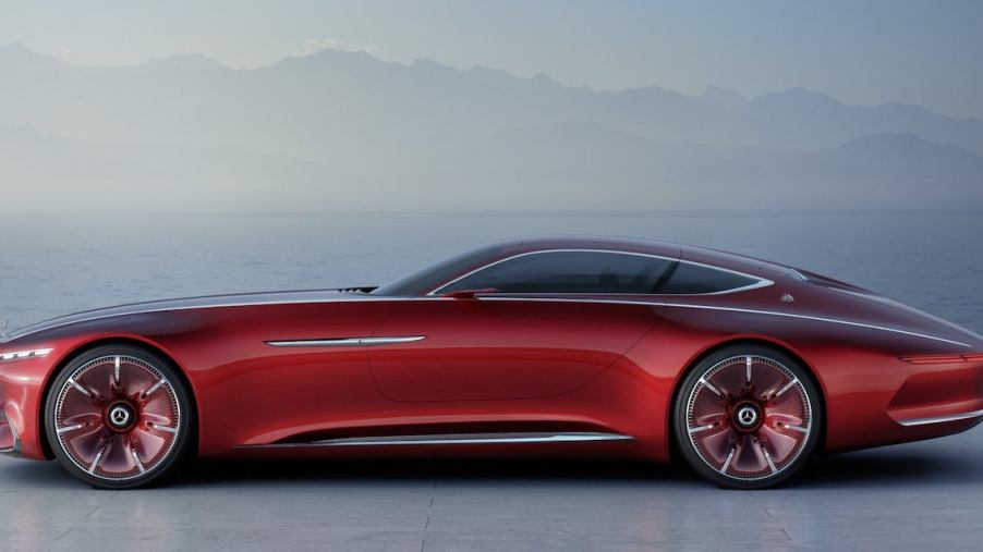 Futuristic Mercedes-Maybach concept coupe in red, a range of mountains just visible in the background.