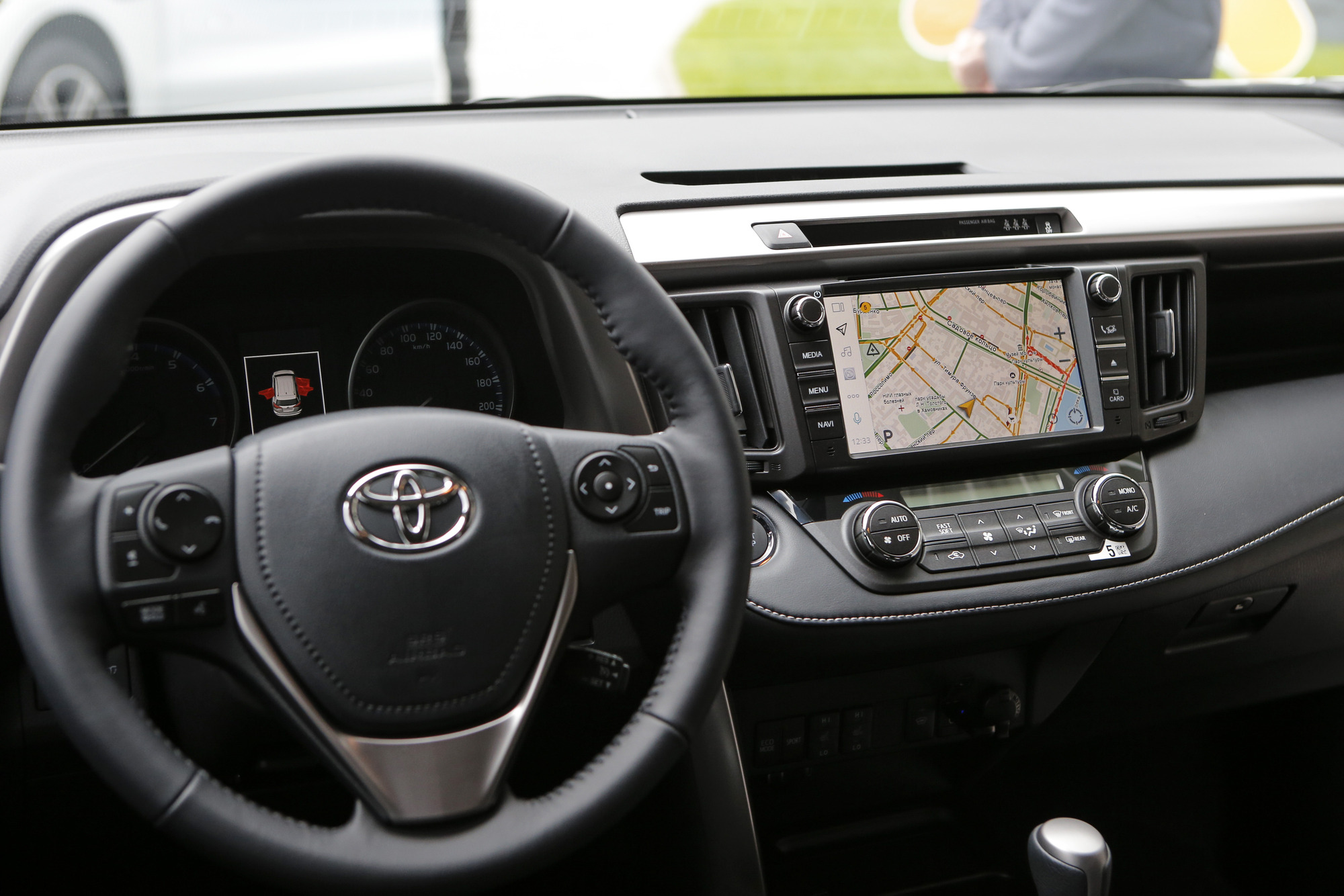 Infotainment system, one of the car features, displaying road navigation map