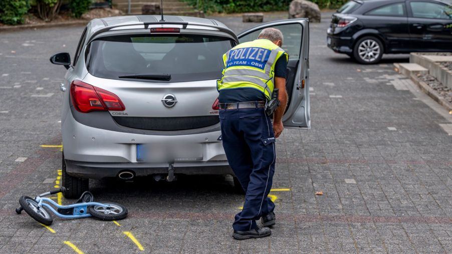 Police inspecting a parking lot accident outside of a bank in North Rhine-Westphalia, Marienheide