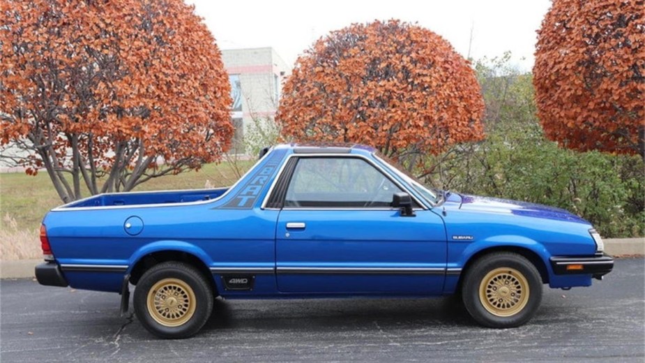 Blue Subaru Brat Parked by some trees