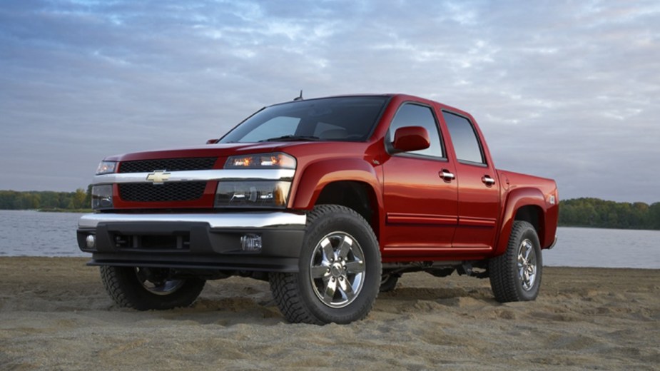 Red 2012 Chevy Colorado posed on the beach