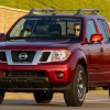Red 2020 Nissan Frontier Driving on the Road