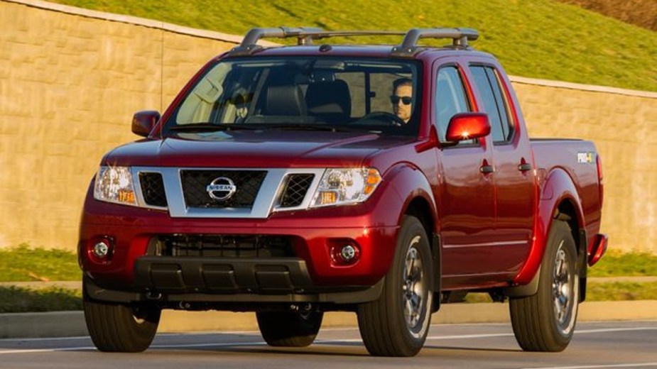 Red 2020 Nissan Frontier Driving on the Road